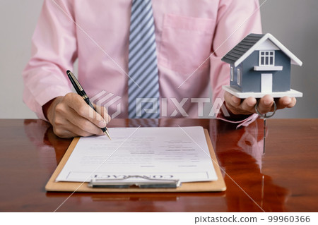 Real estate agent hand holding pen and explain the business contract Real estate agent hand holding pen and explain the business contract 99960366