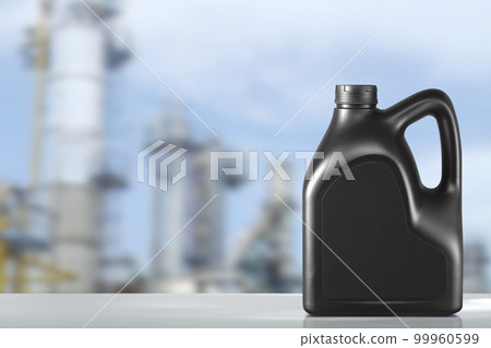 Canister with engine oil against with Oil refinery blurred background Canister with engine oil against with Oil refinery blurred background 99960599