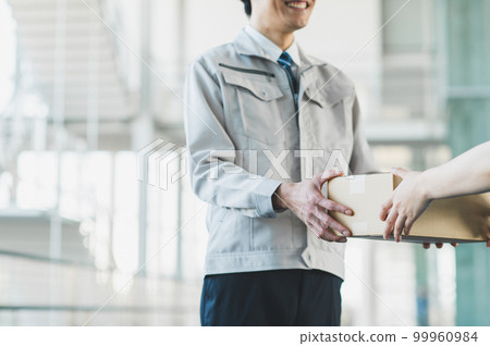 Young businessman working in logistics industry 99960984