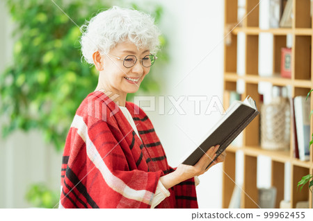 Senior woman reading Senior woman reading 99962455