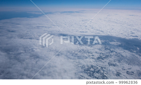 Blue sky, sea and clouds of Shimokita Peninsula seen from an airplane Blue sky, sea and clouds of Shimokita Peninsula seen from an airplane 99962836