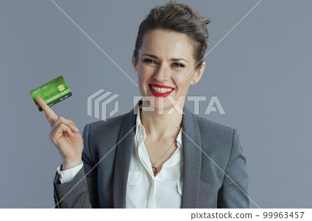 smiling modern woman worker isolated on gray 99963457