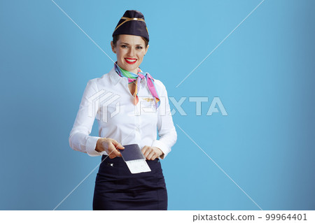 happy modern female stewardess on blue 99964401