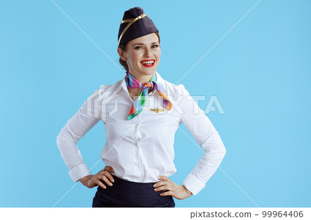 happy stylish flight attendant woman on blue 99964406