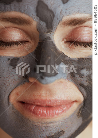 Closeup on modern woman with cosmetic mask 99964505