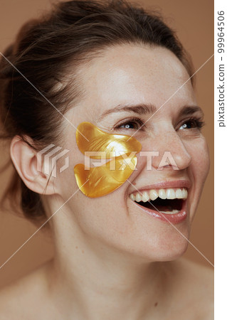 happy young female with eye patches happy young female with eye patches 99964506