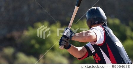 Baseball players in action on the stadium, baseball batter waiting to strike the ball 99964628