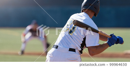 Baseball players in action on the stadium, baseball batter waiting to strike the ball 99964630