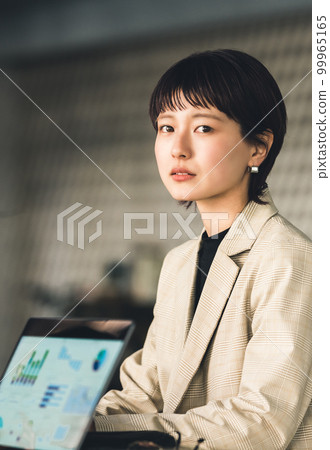 A portrait of a working woman. A portrait of a working woman. 99965165