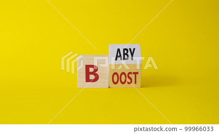 Baby boost symbol. Turned wooden cubes with words Boost and Baby. Beautiful yellow background. Business and baby boost concept. Copy space Baby boost symbol. Turned wooden cubes with words Boost and Baby. Beautiful yellow background. Business and baby boost concept. Copy space 99966033
