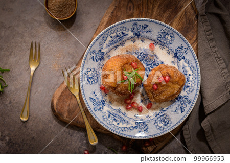 Rabanadas poveiras with sugar and cinnamon Rabanadas poveiras with sugar and cinnamon 99966953