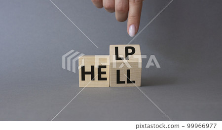 Help vs Hell symbol. Businessman hand points at turned wooden cubes with words Hell and Help. Beautiful grey background. Psychology and Help vs Hell concept. Copy space Help vs Hell symbol. Businessman hand points at turned wooden cubes with words Hell and Help. Beautiful grey background. Psychology and Help vs Hell concept. Copy space 99966977