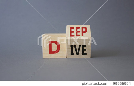 Deep Dive symbol. Concept words deep dive on wooden cubes. Beautiful grey background. Business and Deep Dive concept. Copy space 99966994