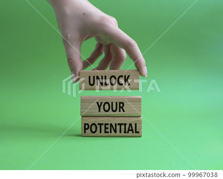 Unlock your Potential symbol. Wooden blocks with words Unlock your Potential. Beautiful green background. Businessman hand. Business and Unlock your Potential concept. Copy space. Unlock your Potential symbol. Wooden blocks with words Unlock your Potential. Beautiful green background. Businessman hand. Business and Unlock your Potential concept. Copy space. 99967038