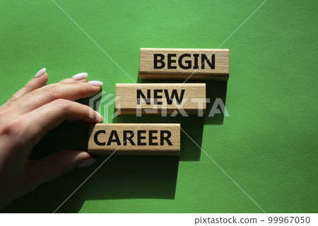 Begin new career symbol. Concept word Begin new career on wooden blocks. Businessman hand. Beautiful green background. Business and Begin new career concept. Copy space 99967050