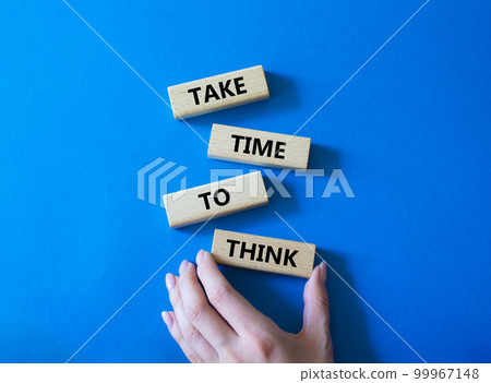 Take time to think symbol. Wooden blocks with words Take time to think. Businessman hand. Beautiful blue background. Business and Take time to think concept. Copy space. 99967148