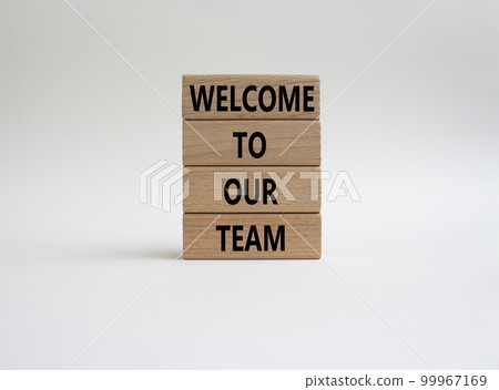 Welcome to our team symbol. Concept words Welcome to our team on wooden blocks. Beautiful white background. Business and Welcome to our team concept. Copy space. 99967169