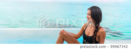 Woman beauty at travel resort pool. Sexy Asian swimwear black lace lingerie model woman relaxing by infinity pool beautiful body chinese beauty. Panoramic banner 99967342