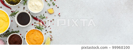 Different types of sauces in bowls 99968100