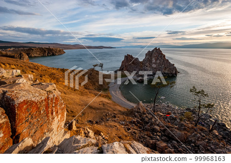Beautiful view of the sacred rock of Shamanka on the island of Olkhon at sunset. Beautiful view of the sacred rock of Shamanka on the island of Olkhon at sunset. 99968163