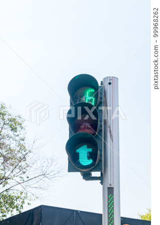 Green pedestrian traffic light in capital of Albania. Green pedestrian traffic light in capital of Albania. 99968262