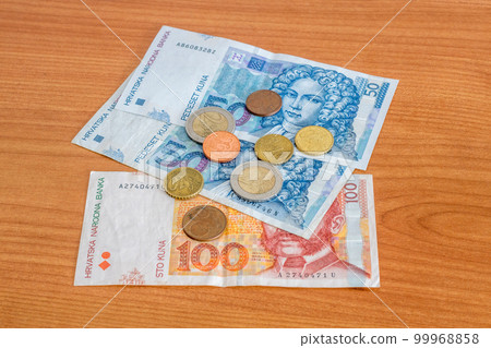 Croatian kuna HRK banknotes and Euro coins. Croatian kuna HRK banknotes and Euro coins. 99968858