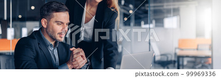 Busy coworkers cooperating and working together at office meeting, teamwork concept Busy coworkers cooperating and working together at office meeting, teamwork concept 99969336
