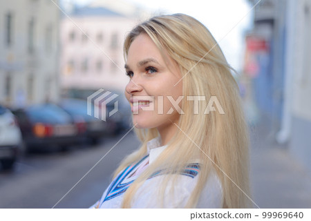 stylish blonde girl on the city street 99969640