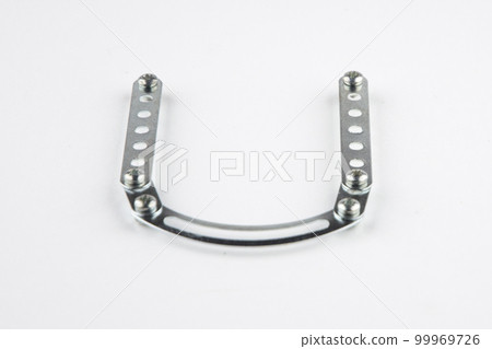 Letter U from the English alphabet of Children's metal designer kit, front view from the top, a short focus on the center Letter U from the English alphabet of Children's metal designer kit, front view from the top, a short focus on the center 99969726