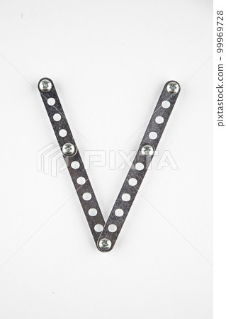 Letter V of English alphabet from Children's metal designer kit Letter V of English alphabet from Children's metal designer kit 99969728
