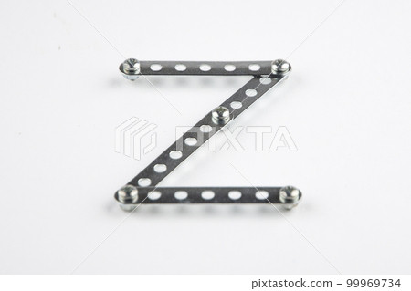 Letter Z from the English alphabet of Children's metal designer kit, front view from the top, a short focus on the center 99969734
