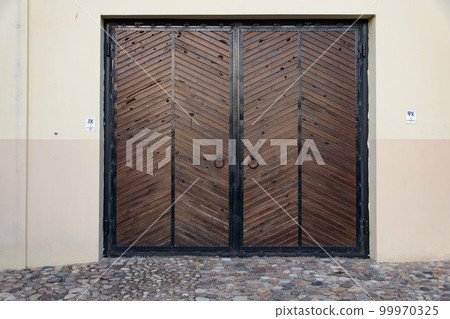 wooden big gate to the building 99970325