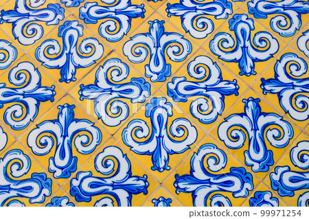 Traditional spanish ceramic tiles in yellow and blue Traditional spanish ceramic tiles in yellow and blue 99971254