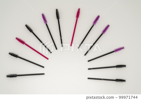 Makeup brushes, eyelash combs and eyebrows on white background with copy space Makeup brushes, eyelash combs and eyebrows on white background with copy space 99971744