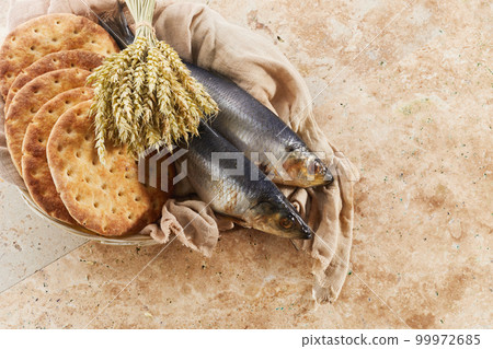 Catholic still life of five loaves of bread and two fish 99972685