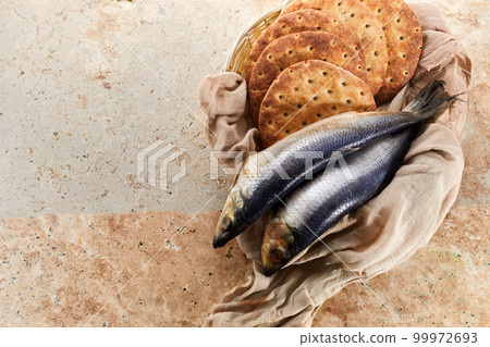 Catholic still life of five loaves of bread and two fish Catholic still life of five loaves of bread and two fish 99972693