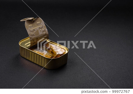 Metal aluminum can of canned sardines in oil with spices and salt 99972767