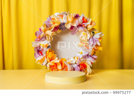 Round podium, pedestal on a bright yellow curtain background 99975277