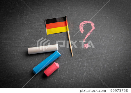 Germany flag and question mark on a chalk board. Politics and economics concept Germany flag and question mark on a chalk board. Politics and economics concept 99975768