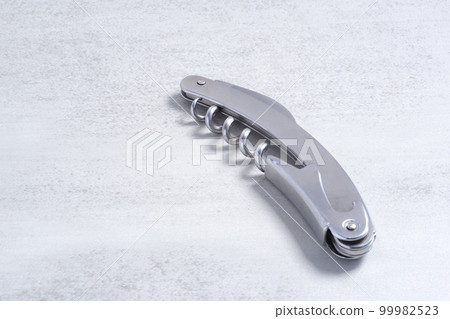 Sommelier knife to open the cork of a bottle of wine Sommelier knife to open the cork of a bottle of wine 99982523