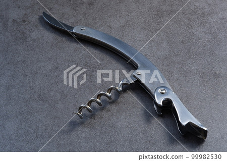 Sommelier knife to open the cork of a bottle of wine Sommelier knife to open the cork of a bottle of wine 99982530