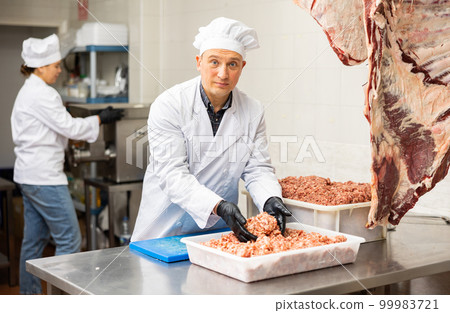 Adult man preparing minced meat in container 99983721