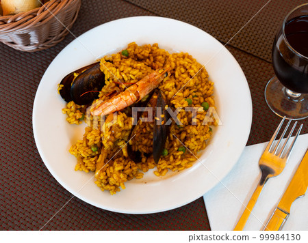 Portion of fresh seafood paella 99984130