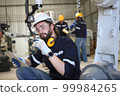 engineer checking auto parts in factory 99984265