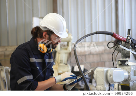 engineer checking auto parts in factory engineer checking auto parts in factory 99984296