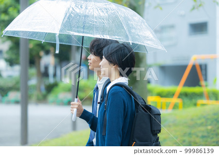 High school student couple rain 99986139