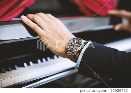 watch on wrist of man watch on wrist of man 99989762