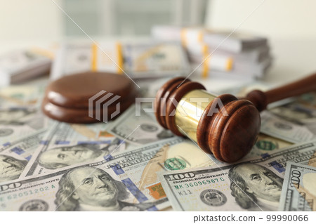 Judge gavel on dollar banknotes background, shallow depth of field. Judge gavel on dollar banknotes background, shallow depth of field. 99990066