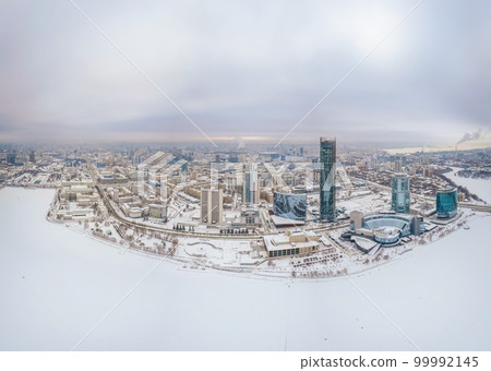 Yekaterinburg city with Buildings of Regional Government and Parliament, Dramatic Theatre, Iset Tower, Yeltsin Center, panoramic view at winter sunset. 99992145