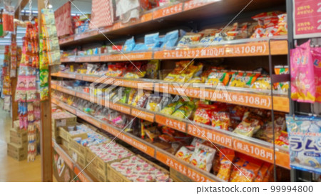 Display shelf of sweets and dagashi in a shop with a blur filter 99994800